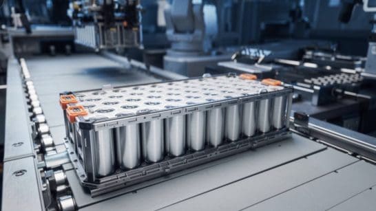 Industrial battery pack with cylindrical cells on a factory conveyor line on an assembly floor